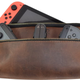 leather switch case with a red joy con against a white background